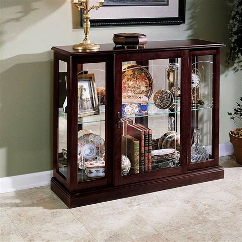 Wayfair curio cabinets - This is the world's largest exclusive manufacturer of curio cabinets. This company began specializing in Occasional Tables. Today the company, as it has from day one, specializes in Curio Cabinets and related items such as hall trees and consoles. You will enjoy displaying treasured family heirlooms in this beautiful curio-style cabinet. This timeless piece will …